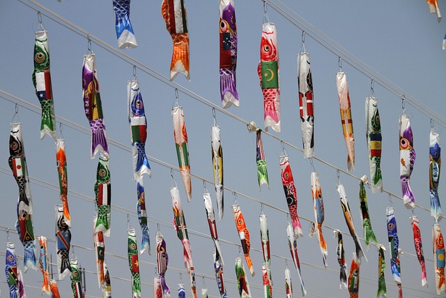 Colorful paper fish hung in rows from strings