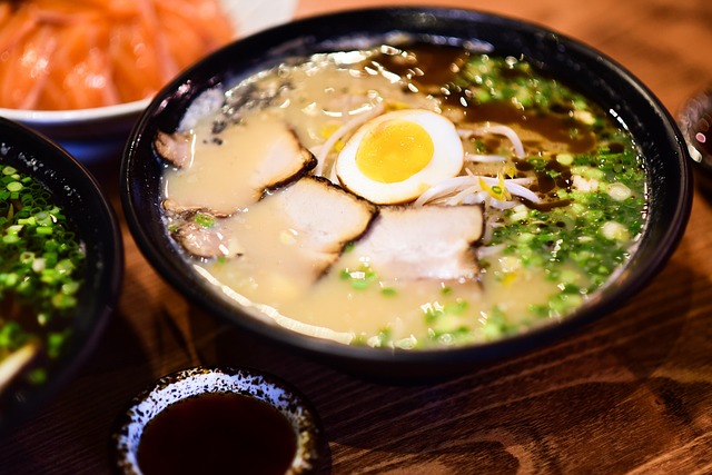Bowl of ramen with pork, eggs, and greens